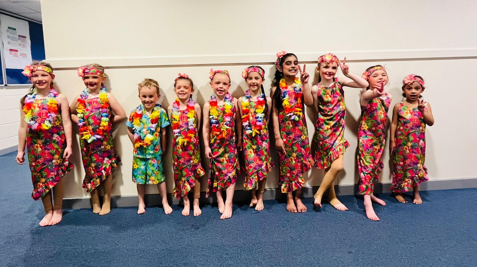 Junior ballet group performing in pink tutus